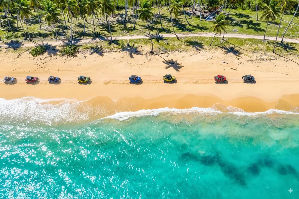 ATV buggies driving along Macao Beach in Punta Cana during an adventure tour from Santo Domingo