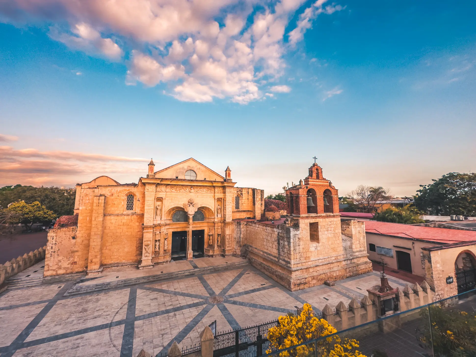 Exterior view of the First Cathedral of the Americas in Santo Domingo, Colonial Zone, at sunset.